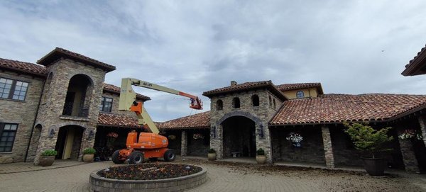Terracotta Tile Roof - This was a 13,000 Sq Foot Terracotta Tile Roof on a vineyard that we had to clean using extension poles and a 85 foot man lift. This job took 4 days to complete with a 3 man team. There's no job too large or too difficult for the team at Referred Roof Cleaning.