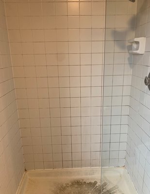 Regrout shower- shower pan cleaning - We did Cleaning the shower pan, Regrout the shower walls and Recaulk the shower. The shower looks brand new again!