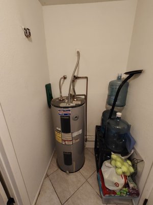 50 Gallon Electric Water Heater Install - This water heater was installed in a customers home late at night after their existing water heater had burst causing water to flood in laundry room. We arrived on sight around 8pm cleaned up all water to the best of our abilities, removed old water heater tank, supply lines and shut off valve. cleaned all piping and installed new stainless steel supply lines, 1/4 turn ball valve in place of original gate valve that was no longer operating properly, comfort pump to help provide hot water to rear of home, and drain pan under water heater to control flow of water in the future if they happen to ever have this issue again. we also provided first year maintanace free with new unit. 50 Gallon Electric Water Heater Install - This water heater was installed in a customers home late at night after their existing water heater had burst causing water to flood in laundry room. We arrived on sight around 8pm cleaned up all water to the best of our abilities, removed old water heater tank, supply lines and shut off valve. cleaned all piping and installed new stainless steel supply lines, 1/4 turn ball valve in place of original gate valve that was no longer operating properly, comfort pump to help provide hot water to rear of home, and drain pan under water heater to control flow of water in the future if they happen to ever have this issue again. we also provided first year maintanace free with new unit.