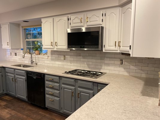 Kithcen Remodel Tile, Painting, Countertops in Littleton - Our clients bought a new home and wanted to update their kitchen. We helped them choose finishes and products that are beautiful and durable. We painted the cabinets, installed new quartz countertops, installed a new tile backsplash, and installed new flooring in the kitchen and throughout the rest of the home. The owners love their new space and even left us a 5 star review on Yelp and Google! Kithcen Remodel Tile, Painting, Countertops in Littleton - Our clients bought a new home and wanted to update their kitchen. We helped them choose finishes and products that are beautiful and durable. We painted the cabinets, installed new quartz countertops, installed a new tile backsplash, and installed new flooring in the kitchen and throughout the rest of the home. The owners love their new space and even left us a 5 star review on Yelp and Google!