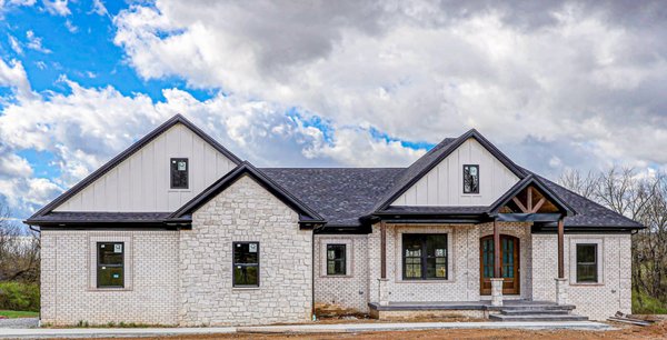Single Family Custom Home Build - This beautiful custom Kentucky home boasts a gorgeous open floor plan, custom designed fireplace, four bedrooms, 3 full bathrooms, primary bedroom and bathroom suite with a double vanity, soaking tub, full shower, two walk-in closets. The kitchen features a large island, butler pantry, and custom cabinetry. The basement features 10-foot ceilings, walkout patio, full kitchen, large, open living space, bonus room, office space, and stunning views.