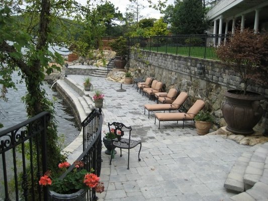 HARDSCAPES - Hardscapes are more than just patios and walkways. When designed properly and installed professionally, a great hardscape project can seamlessly blend landscape, architectural and natural elements, increasing property value while creating a more aesthetic and functional use of available space.
We Specialize in :
Paver & Natrual Stone Patios
Walkways
Paver Driveways
Retaining Walls
Seat Walls
Natraul Stone Work
Masonry Steps & Landings
Karney Stone Steps
Outdoor Firepits
Outdoor Fireplaces
From design to install, our team of NCMA and ICPI certified hardscape professionals understand the importance of detail. Our skilled masons create artistry with stonework and our firm was chosen to be the hardscape contractor of choice for the Hurricane Sandy relief efforts at the Statue of Liberty. HARDSCAPES - Hardscapes are more than just patios and walkways. When designed properly and installed professionally, a great hardscape project can seamlessly blend landscape, architectural and natural elements, increasing property value while creating a more aesthetic and functional use of available space.
We Specialize in :
Paver & Natrual Stone Patios
Walkways
Paver Driveways
Retaining Walls
Seat Walls
Natraul Stone Work
Masonry Steps & Landings
Karney Stone Steps
Outdoor Firepits
Outdoor Fireplaces
From design to install, our team of NCMA and ICPI certified hardscape professionals understand the importance of detail. Our skilled masons create artistry with stonework and our firm was chosen to be the hardscape contractor of choice for the Hurricane Sandy relief efforts at the Statue of Liberty.