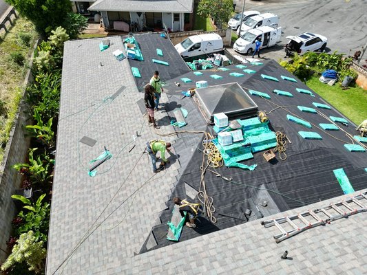Remove Old Roofing - In this picture, we are removing old shingles and installing new asphalt shingles. This is a great job the All Around Roofing Team completed