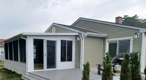 Sunroom - This Sunroom was done so the customer could enjoy more space while enjoying the outdoors from the inside. The deck added to the appeal. Sunroom - This Sunroom was done so the customer could enjoy more space while enjoying the outdoors from the inside. The deck added to the appeal.