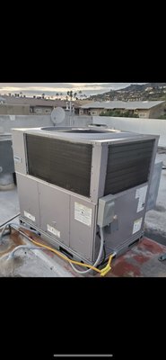 Replacing a 4 ton gas electric package unit. - This customer had a refrigerant leak in the evaporator coil due to rust and corrosion and decided that replacing the unit would be the best option.