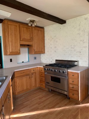 Bogart Farmhouse - SERVICES:

Grain fill oak doors, butcher block countertops, shiplap walls and backsplash, removed desk area and added cabinetry for a coffee bar area, added crown molding, removed cabinets to open the space, new sink, hardware and soft close hinges.