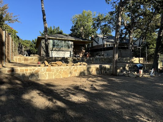 Retaining wall - Retaining wall and French drain project on the boarding house in Austin, Texas Retaining wall - Retaining wall and French drain project on the boarding house in Austin, Texas