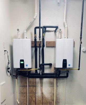 Retro-fit Tankless Water Heater - Final installation of Navian tankless water heaters ran in a series to deliver a continuous flow of hot water for a 5 bathroom home. No more waiting for a tank to reheat more water, wasting time and or energy. Call now for a free quote!