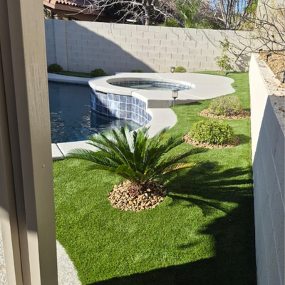 A Poolside Designed to Stand Out - This poolside space was transformed with vibrant turf, a clean paver border, and thoughtfully placed plants that bring the whole design together. The result is a polished, low-maintenance landscape that feels fresh, balanced, and perfect for relaxing by the water. A Poolside Designed to Stand Out - This poolside space was transformed with vibrant turf, a clean paver border, and thoughtfully placed plants that bring the whole design together. The result is a polished, low-maintenance landscape that feels fresh, balanced, and perfect for relaxing by the water.