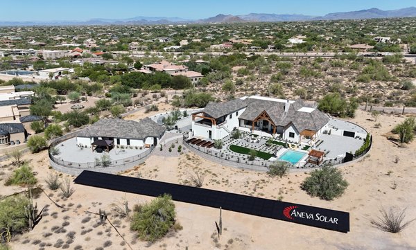 50kW Ground-Mounted Solar Array in Scottsdale: Sustainable Power Meets Desert Elegance - Aneva Solar proudly presents this impressive 50 kW ground-mounted solar array in Scottsdale, AZ, exemplifying the company’s ability to design large-scale, aesthetically integrated solar solutions for luxury properties. This custom ground-mounted installation was meticulously planned to blend with the natural desert landscape surrounding the home, providing the homeowners with an efficient and environmentally friendly energy source while preserving the beauty of their property.

This project presented a unique opportunity for Aneva Solar to showcase their expertise in creating ground-mounted arrays that complement upscale residential estates. Situated at a careful distance from the main residence, the solar array is positioned to maximize exposure to Arizona’s abundant sunlight, ensuring peak energy production throughout the year. The result is a high-performing, low-profile system that harmonizes with the terrain, offering a clean and unobtrusive energy solution that supports the homeowner’s sustainability goals.

In designing this system, Aneva Solar was mindful of both function and form. The array’s location and layout were selected to minimize visual impact from the main living areas while still delivering optimal solar performance. By working closely with the homeowners, Aneva Solar was able to meet their energy needs and preserve the overall aesthetics of their property, transforming what could have been a stark installation into a seamless part of their luxurious desert home.

The homeowners are thrilled with their state-of-the-art solar system, which not only significantly reduces their carbon footprint but also aligns with their vision for a sustainable yet elegant lifestyle. This Scottsdale project underscores Aneva Solar’s commitment to delivering customized solar solutions that harmonize with each client’s architectural and environmental landscape, no matter the scope or complexity.