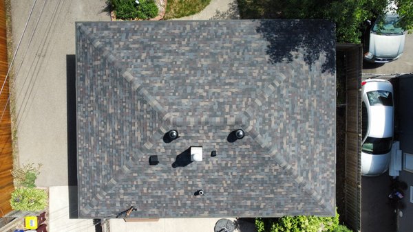 Owens Corning Duration FLEX - Black Sable - Mark and Robyn's home had a persistent roof leak that they couldn't fix. After a thorough inspection, we found the roof was aging prematurely due to poor ventilation—a common issue for hip roofs. The lack of proper airflow was causing heat buildup, which was damaging the shingles.
A persistent leak and premature shingle wear were just the beginning for this homeowner. Our inspection revealed a common problem for hip roofs: poor ventilation and excessive heat buildup were damaging the roof.
We installed a new, durable Class 4 impact-resistant roof that not only fixed the leak for good but also earned the homeowner a major discount on their insurance. To protect their investment, we upgraded the attic's ventilation with turbines, which actively remove heat and improve airflow. This change will extend the life of the new roof, lower energy costs, and keep the home more comfortable year-round.
And because we stand by our work, this project is backed by our 15-year workmanship warranty and a lifetime shingle warranty, giving Mark and Robyn complete peace of mind. Owens Corning Duration FLEX - Black Sable - Mark and Robyn's home had a persistent roof leak that they couldn't fix. After a thorough inspection, we found the roof was aging prematurely due to poor ventilation—a common issue for hip roofs. The lack of proper airflow was causing heat buildup, which was damaging the shingles.
A persistent leak and premature shingle wear were just the beginning for this homeowner. Our inspection revealed a common problem for hip roofs: poor ventilation and excessive heat buildup were damaging the roof.
We installed a new, durable Class 4 impact-resistant roof that not only fixed the leak for good but also earned the homeowner a major discount on their insurance. To protect their investment, we upgraded the attic's ventilation with turbines, which actively remove heat and improve airflow. This change will extend the life of the new roof, lower energy costs, and keep the home more comfortable year-round.
And because we stand by our work, this project is backed by our 15-year workmanship warranty and a lifetime shingle warranty, giving Mark and Robyn complete peace of mind.