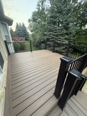 Deck Transformation! - For this deck renovation, the client requested an update to the surface and staircase while retaining the existing structural framing. We repaired and reinforced sections of the original wood frame where damage from the previous deck had occurred, ensuring it met safety and durability standards.
We then installed new composite deck boards in a rich, low-maintenance wood tone, along with a brand-new staircase to match. Sleek black aluminum railings were added throughout, offering a modern finish with long-lasting performance. The result is a refreshed, structurally sound outdoor space that combines safety, functionality, and curb appeal—another high-quality transformation by MD&CD Home Improvements. Deck Transformation! - For this deck renovation, the client requested an update to the surface and staircase while retaining the existing structural framing. We repaired and reinforced sections of the original wood frame where damage from the previous deck had occurred, ensuring it met safety and durability standards.
We then installed new composite deck boards in a rich, low-maintenance wood tone, along with a brand-new staircase to match. Sleek black aluminum railings were added throughout, offering a modern finish with long-lasting performance. The result is a refreshed, structurally sound outdoor space that combines safety, functionality, and curb appeal—another high-quality transformation by MD&CD Home Improvements.