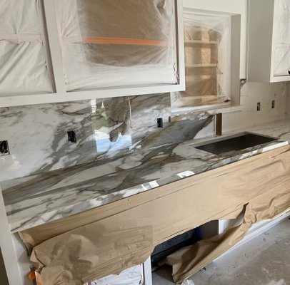 Porcelain Slab Countertops - Porcelain Countertops are becoming more popular in Kitchens as a work surface. We added this service in 2020 as it started hitting the market. It is a durable choice for countertops and welcome it. We have done many kitchens, Showers,Feature Walls, Fireplaces etc. Feel free to call us so we can answer any questions you may have about this exciting trend