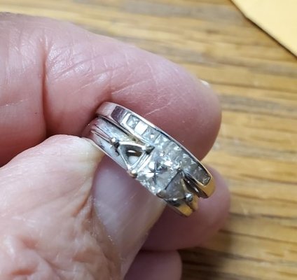 Upgrading to a Larger Center Diamond - This customer had lost one of her side diamonds and wanted a 1 ct princess cut diamond to replace her 1/2 ct center diamond. My jeweler saw immediately that the setting had been repaired incorrectly previously and it would not be safe to reuse the setting. He drew up the exact measurements and we had our computer designer create the necessary new setting. It went from start to finish in less then 10 days and the customer was thrilled with her ring which looked better than when it was new.