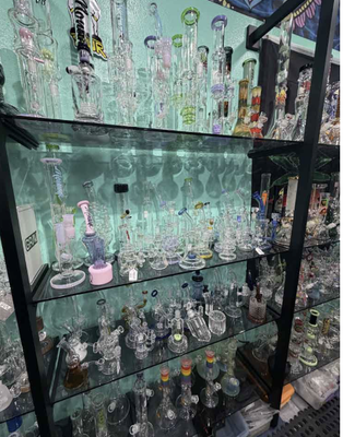Pipes - We are a smoke shop/boutique
that carries a uniquely wide variety of items from all over the world! Specializing in water pipes, heady glass (production glass too),
dab rigs, dry glass spoons-sherlocks-sidecars, wood/acrylic/metal pipes, dugouts,
portable & table top vaporizers, hookahs, shisha, grinders, trays, papers, Tobacco, vintage clothing, body jewelry,
home decor, tapestries, incense
and sooo much more! Pipes - We are a smoke shop/boutique
that carries a uniquely wide variety of items from all over the world! Specializing in water pipes, heady glass (production glass too),
dab rigs, dry glass spoons-sherlocks-sidecars, wood/acrylic/metal pipes, dugouts,
portable & table top vaporizers, hookahs, shisha, grinders, trays, papers, Tobacco, vintage clothing, body jewelry,
home decor, tapestries, incense
and sooo much more!