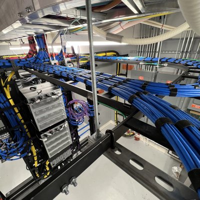 Structured cabling solutions - We specialize in structured cabling for projects of every scale, from Hospitals to single-family homes. No matter the size or scope, we’ve got you covered. Whether you need Cat6 - Cat8, or even fiber optic runs, we design and install with precision, ensuring your network is built to perform at today’s standards while staying ready for tomorrow’s technology.

But for us, cabling isn’t just about function, it’s about craftsmanship. We don’t just run cables; we treat it as an artform. Every line is carefully planned, routed, and secured with precision. Every connection is tested, labeled, and documented for future service and scalability. 

Your IT closet or network equipment room shouldn’t be a tangled mess of wires. Instead, it should be a clean, structured hub that reflects professionalism and reliability. That’s why we emphasize meticulous cable management: clean lines, symmetrical layouts, and clear labeling. A tidy installation not only simplifies troubleshooting and upgrades but also showcases the quality and attention to detail your business deserves.

From backbone fiber optic cabling in multi-unit buildings to custom residential network setups, we bring the same level of detail, discipline, and dedication to every project. When you choose us, you’re not just getting cables, you’re getting a network designed to perform, impress, and stand the test of time.