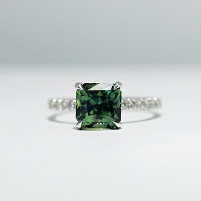 Custom Designed Green Sapphire Ring - We work closely with our clients to help them select the perfect center stone and design a ring around the stone that is unique and fits with their vision. When designing we know it takes real listening to hear what is important to a client. We can add gentle guidance on what will wear well every day, and what structures work best when building a ring. The end result is exciting, stunning and built to last. Custom Designed Green Sapphire Ring - We work closely with our clients to help them select the perfect center stone and design a ring around the stone that is unique and fits with their vision. When designing we know it takes real listening to hear what is important to a client. We can add gentle guidance on what will wear well every day, and what structures work best when building a ring. The end result is exciting, stunning and built to last.