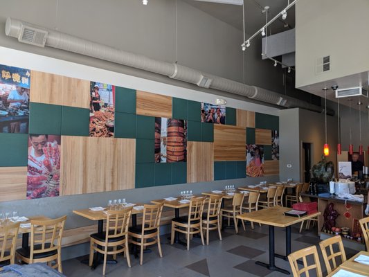 Lin Jia Asian Kitchen - This project consisted of a new 30 ft long accent wall above a row of seating.  It's a mixed medium concept, woth green sound abosortion panels, gorgeous hardwood panels, and photos.  This combinaiton makes for a huge visual interest to the space. We also built new custom benches. This project can be seen at Lin Jia Asian Kitchen in Oakland.