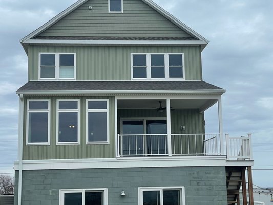 Upper Deck Remodel - This beautiful Upper deck Remodel was done according to our customer request, the original existing was an open screen porch, and based on the needs of the customer, was converted to a Four Seasons Sunroom / Back Deck / Stairs / Railing.