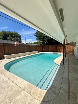 Backyard Remodel - This remodel took an outdated backyard and turned it into a modern spacious area to entertain, enjoy, and make memories. The pool was resurfaced with aqua cool mini pebble, paired with glass tile and natural stone coping. The deck was upgraded with new drainage and travertine pavers. Backyard Remodel - This remodel took an outdated backyard and turned it into a modern spacious area to entertain, enjoy, and make memories. The pool was resurfaced with aqua cool mini pebble, paired with glass tile and natural stone coping. The deck was upgraded with new drainage and travertine pavers.