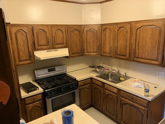 Glendale Queens Kitchen Renovation - Full kitchen remodel including new walls, floors, cherry colored Maple Cabinetry with soft close hardware, subway tiled backsplash and a beautiful Quartz countertop with gray veining to compliment the style.