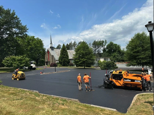Paving - Asphalt pavement is known for it's durability and resilience. It is made up of stone, sand, additives and liquid asphalt - used as the binding material. The flexibility found in asphalt pavement is one if its greatest strengths. The proper clearing, excavation, ground compaction and base materials require a great deal of expertise to be done before the asphalt is applied. Once ready, it is laid using an asphalt paver and rollers. Proper rolling methods have to be used to ensure proper compaction.
Once the asphalt mix is compacted on the driveway, it should be left for hardening. A minimum of 24 hours is required for the asphalt mix to harden before it can be used. If enough time is not allowed for hardening, then it will result in poor a quality pavement. You may ruin your beautiful driveway or parking lot by using it to soon.
Our materials and consistent methods will provide a smooth and durable finish perfect for both residential and commercial purposes. You can count on our experts for quality paving solutions. Paving - Asphalt pavement is known for it's durability and resilience. It is made up of stone, sand, additives and liquid asphalt - used as the binding material. The flexibility found in asphalt pavement is one if its greatest strengths. The proper clearing, excavation, ground compaction and base materials require a great deal of expertise to be done before the asphalt is applied. Once ready, it is laid using an asphalt paver and rollers. Proper rolling methods have to be used to ensure proper compaction.
Once the asphalt mix is compacted on the driveway, it should be left for hardening. A minimum of 24 hours is required for the asphalt mix to harden before it can be used. If enough time is not allowed for hardening, then it will result in poor a quality pavement. You may ruin your beautiful driveway or parking lot by using it to soon.
Our materials and consistent methods will provide a smooth and durable finish perfect for both residential and commercial purposes. You can count on our experts for quality paving solutions.