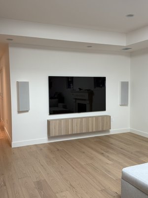 Custom made speaker box and 77” LG Frame TV installation w/ floating in-wall mount shelf for home and business applications by Wiztec. - “Our recent completed project showcases the expertise of our techs in delivering custom solutions. We successfully installed custom-made in-wall speaker boxes, overcoming the challenge of limited space between walls, and seamlessly mounted a 77” LG Frame TV with floating shelves. This project highlights our ability to create tailored, high-quality installations that enhance both functionality and aesthetics for our clients.”