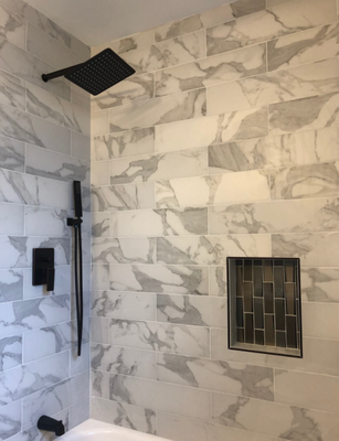 Modern Bathroom - Oil rubbed bronze rain shower head against the marble look tile gives beautiful contrast and a bold statement in the small master bathroom shower. The marble floor adds to the elegant and spa feel of this space.
Inspiration for a mid-sized transitional master gray tile and ceramic tile marble floor and white floor bathroom remodel in Chicago with shaker cabinets, dark wood cabinets, a two-piece toilet, gray walls, a console sink, marble countertops and white countertops Modern Bathroom - Oil rubbed bronze rain shower head against the marble look tile gives beautiful contrast and a bold statement in the small master bathroom shower. The marble floor adds to the elegant and spa feel of this space.
Inspiration for a mid-sized transitional master gray tile and ceramic tile marble floor and white floor bathroom remodel in Chicago with shaker cabinets, dark wood cabinets, a two-piece toilet, gray walls, a console sink, marble countertops and white countertops