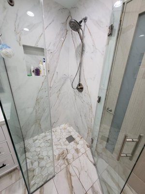 Bathroom remodeling - Porcelain slab shower walls.