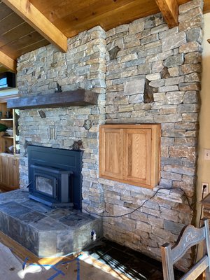 Fireplace Renovation - The client called me up and told me they wanted to install natural stone on the face and the hearth of this fireplace. The client also wanted to extend the hearth and wanted us to leave the exsisting stone that was previosly installed, so we worked around it and this is the finish product! Before and after pictures are provided.