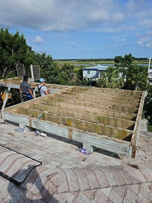 Rooftop Deck Repair - This client had a rooftop deck that needed to be replaced. We built a new structure and walkway design, replaced joists, built new crickets, and applied joist tape to ensure protection from water. We used high quality deck boards and a stainless steel cable system. The client was left very happy with their new rooftop deck. Rooftop Deck Repair - This client had a rooftop deck that needed to be replaced. We built a new structure and walkway design, replaced joists, built new crickets, and applied joist tape to ensure protection from water. We used high quality deck boards and a stainless steel cable system. The client was left very happy with their new rooftop deck.
