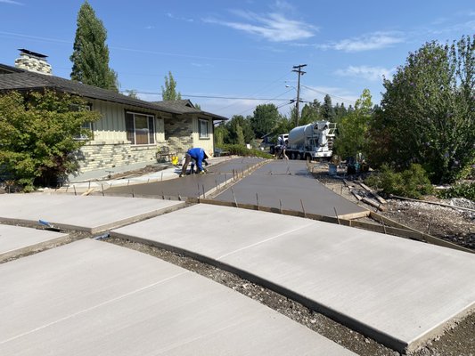 Driveway construction with paver borders - This originally was decaying asphalt located on Skyline drive in Reno. The asphalt was removed, gravel base was installed and compacted. We formed for the concrete installation allowing for exterior and exterior channels for the pavers. Once the concrete was poured we installed the pavers. Nothing but excellent reviews on the workmanship from the owner, his family and people passing by. Driveway construction with paver borders - This originally was decaying asphalt located on Skyline drive in Reno. The asphalt was removed, gravel base was installed and compacted. We formed for the concrete installation allowing for exterior and exterior channels for the pavers. Once the concrete was poured we installed the pavers. Nothing but excellent reviews on the workmanship from the owner, his family and people passing by.