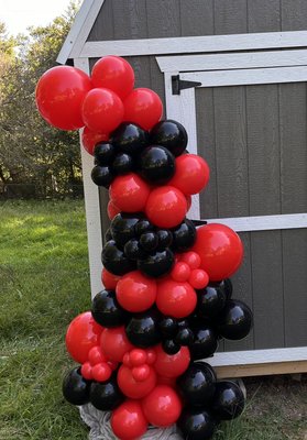 Red and black freestanding garland - This freestanding garland was for a Georgia football themed celebration.