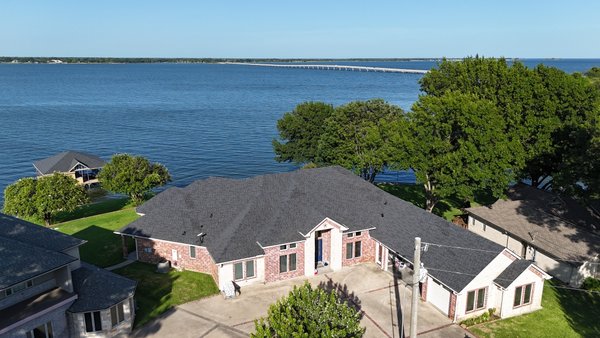 Lakefront Roof Replacement - LAKEFRONT ROOF REPLACEMENT 

Complete roof replacement on this beautiful lakefront home and matching boathouse. Our team installed a new architectural shingle roofing system across the home’s large, complex roof design, paying close attention to the hips, valleys, transitions, and numerous roof sections to ensure a clean, consistent finished appearance.

The matching boathouse roof was also completed to tie the entire property together. The result is a sharp, durable roofing system that complements the home and its waterfront setting while providing long-term protection from the elements.

ArkLaTex Roofing & Construction
Quality you can see, integrity you can trust.