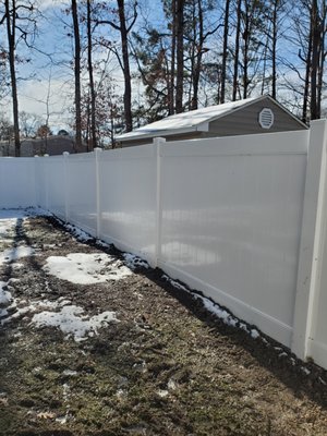 Vinyl Privacy Fence - This is an installation of 181lft of 6' Hatteras vinyl fencing with one single gate. First, we cleared the fence line of all shrubs and debris prior to the installation. Vinyl Privacy Fence - This is an installation of 181lft of 6' Hatteras vinyl fencing with one single gate. First, we cleared the fence line of all shrubs and debris prior to the installation.