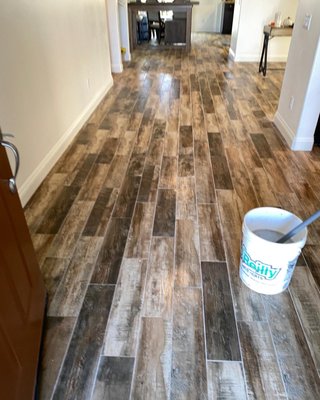 Woodlook tile 6x24 - Old laminate and carpet removed 
New tile