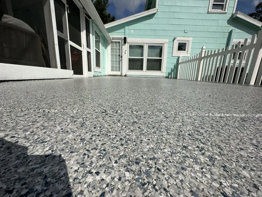 Patio in Tidal Wave Flake - This was a Polyaspartic topcoat with Tidal Wave flake. The concrete was grinded and patched before a Moisture vapor barrier was used as a basecoat Patio in Tidal Wave Flake - This was a Polyaspartic topcoat with Tidal Wave flake. The concrete was grinded and patched before a Moisture vapor barrier was used as a basecoat