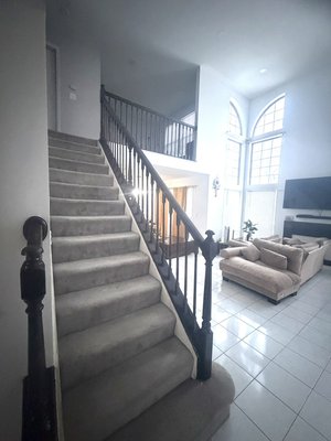 Staircase Refinishing & Dark Brown Staining - We transformed this staircase by applying a rich dark brown stain directly over the original light oak. This process refreshed the handrail and spindles, giving the home a modern and elegant. Staircase Refinishing & Dark Brown Staining - We transformed this staircase by applying a rich dark brown stain directly over the original light oak. This process refreshed the handrail and spindles, giving the home a modern and elegant.