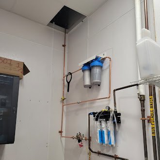 Water Filtration & Softener System Install – Basement & Utility Wall - 3R Plumbing installed a complete water filtration and softener system designed to improve household water quality. The setup includes sediment and carbon filters mounted with precision, along with a high-efficiency twin-tank NXT softener and brine tank. Clean copper piping ensures optimal flow and durability. This system provides long-term protection for plumbing fixtures and delivers cleaner, softer water throughout the home. Another quality installation by the 3R Plumbing team — done right, the first time.