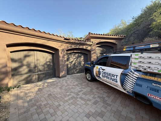Fountain Hills Triple Door Upgrade Project - This Fountain Hills home received a complete three-door transformation. We replaced three aging wooden garage doors with modern woodgrain-style doors featuring elegant window inserts, giving the home a cleaner, more upscale appearance while allowing natural light into the garage. To complete the project, we installed three brand-new garage door openers and performed a full system setup, ensuring each door operates quietly, smoothly, and reliably. Fountain Hills Triple Door Upgrade Project - This Fountain Hills home received a complete three-door transformation. We replaced three aging wooden garage doors with modern woodgrain-style doors featuring elegant window inserts, giving the home a cleaner, more upscale appearance while allowing natural light into the garage. To complete the project, we installed three brand-new garage door openers and performed a full system setup, ensuring each door operates quietly, smoothly, and reliably.