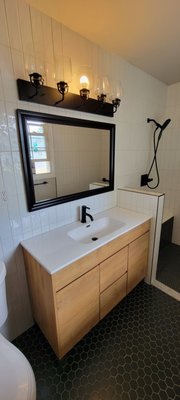 Bathroom Remodel - Clairemont, CA - This cozy little bathroom was expanded and remodeled to make handicap accessible for our client.
A matte black grab bar was installed in the shower and a built in bench was added. New flooring, a floating vanity, and a floor to ceiling tiled wall was also installed. Bathroom Remodel - Clairemont, CA - This cozy little bathroom was expanded and remodeled to make handicap accessible for our client.
A matte black grab bar was installed in the shower and a built in bench was added. New flooring, a floating vanity, and a floor to ceiling tiled wall was also installed.