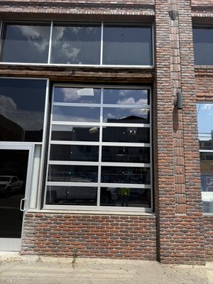 Glass aluminum sectional door - Installed an 8’ x 11’ glass aluminum sectional door in a commercial shop in Los Angeles, delivering a modern look with durable, high-quality performance. Glass aluminum sectional door - Installed an 8’ x 11’ glass aluminum sectional door in a commercial shop in Los Angeles, delivering a modern look with durable, high-quality performance.