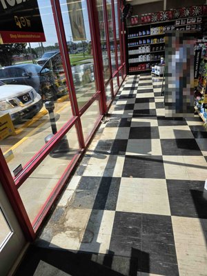 VCT Repair in a retail store - We completed a quick flooring repair in a retail store, right in front of a leaking window where water had damaged the VCT. After sealing the windows to stop the leak, we removed the damaged tiles, dried and prepped the floor, and installed new VCT to perfectly match the existing pattern. The workspace was safely sealed off to prevent dust or odors, and the retail store was able to stay open without any interruptions during the repair.