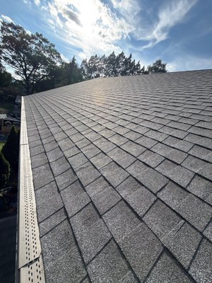 Lancaster Roof Replacement With GAF Shingles and Low-Slope EPDM Roofing - For this Lancaster home, our team replaced the existing shingle roof after inspection showed loose shingles, visible nail pops, organic growth, and an aging low-slope EPDM section. The project included removal of the old roofing materials, installation of a GAF Timberline NS System Plus roof, new underlayment, starter shingles, ridge cap shingles, pipe flashings, chimney flashing, step and headwall flashing, counter flashing, OSB decking, and a new EPDM rubber roofing system on the low-slope section.