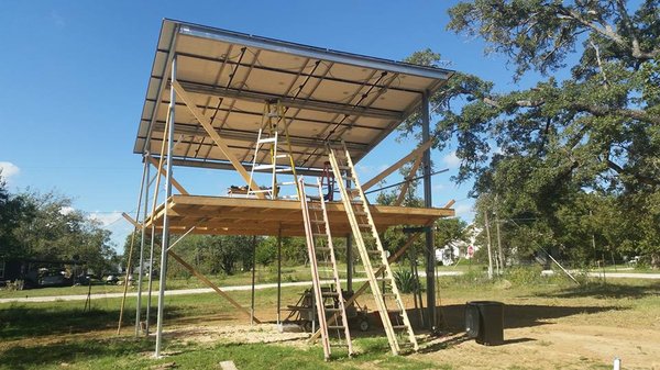 Solar 2-story Studio - For this project we added built the metal frame, added solar panels, battery bank backup, Sol-Ark inverter, EV charging station. This home can be on the grid or off grid with the setup created. One happy homeowner.