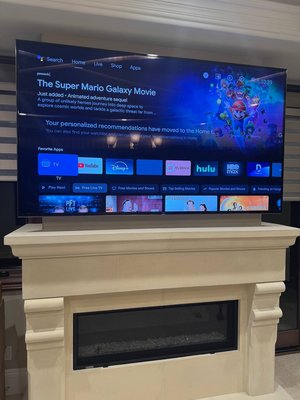 Fireplace TV Mount/Cable Concealment - Client had a Sony TV waiting to go up over their stone fireplace mantel, with power and cables needing to run fully hidden behind the wall. We mounted the TV flush and centered above the mantel, tucked all cabling out of sight through an in-wall access panel, and made sure the finished look was clean with no visible wires anywhere.