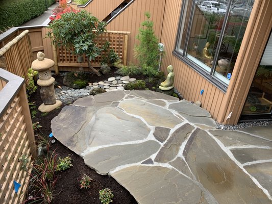 Floating Flagstone Patio - This is a very unique Floating patio that was installed near Granville Island. We try not to do standard work, rather classical work that can be enjoyed for many years to come Floating Flagstone Patio - This is a very unique Floating patio that was installed near Granville Island. We try not to do standard work, rather classical work that can be enjoyed for many years to come