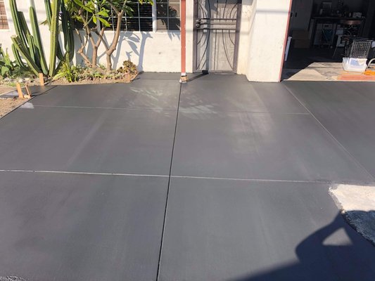 Black concrete installed - Driveway demolition . Black cement installed after .
