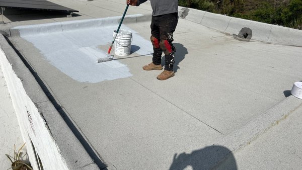 Silicone Coating Overlay on Flat Roof - Silicone coating is a cost-effective and eco-friendly way to address any areas prone to leaks on a flat roof. The silicone waterproofing forms a continuous, watertight membrane over your roof, sealing leaks and preventing water infiltration. Silicone overlay helps reflect the sun’s rays, reducing heat absorption and lowering energy costs while protecting your roof from UV damage. Silicone Coating Overlay on Flat Roof - Silicone coating is a cost-effective and eco-friendly way to address any areas prone to leaks on a flat roof. The silicone waterproofing forms a continuous, watertight membrane over your roof, sealing leaks and preventing water infiltration. Silicone overlay helps reflect the sun’s rays, reducing heat absorption and lowering energy costs while protecting your roof from UV damage.