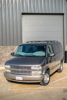 Chevy Astro Van Restoration - This Chevy Astro van spent 9 months in the shop getting everything from a new short block to a power steering overhaul. When the owner finally got the van back it was in desperate need of a refresh. We brought this van back to life through 2 full days of work. We washed, decontaminated, and prepped the exterior before polishing all the painted surfaces as well as the wheels. We then ceramic coated the paint, headlights, taillights, glass, and wheel faces.
We also shampoo'ed the seats and carpets on the interior and deep cleaned and conditioned the plastics. Chevy Astro Van Restoration - This Chevy Astro van spent 9 months in the shop getting everything from a new short block to a power steering overhaul. When the owner finally got the van back it was in desperate need of a refresh. We brought this van back to life through 2 full days of work. We washed, decontaminated, and prepped the exterior before polishing all the painted surfaces as well as the wheels. We then ceramic coated the paint, headlights, taillights, glass, and wheel faces.
We also shampoo'ed the seats and carpets on the interior and deep cleaned and conditioned the plastics.